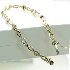 Gold Over 925 Sterling Silver Blue Topaz Tennis Bracelet